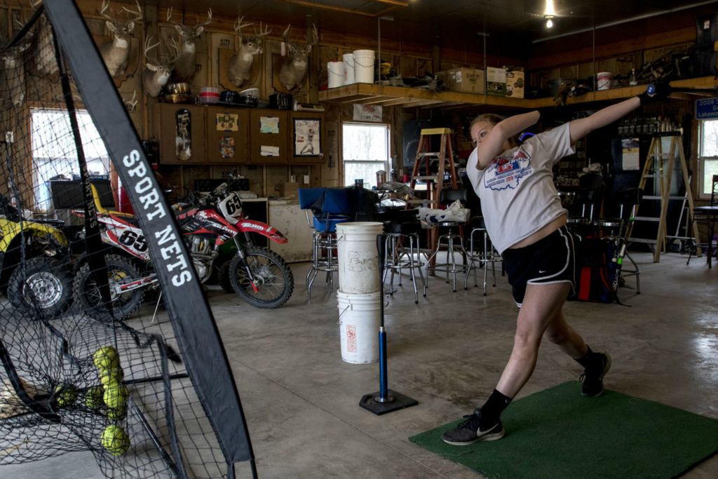 First Place, Sports Picture Story - Jessica Phelps / Newark Advocate, “The Season That Almost Was”Keelie Davis practices her hitting skills in her garage in April during the shut down. Davis, like her teammates, remained hopeful their season would not be completely canceled and wanted to keep her skills sharp.